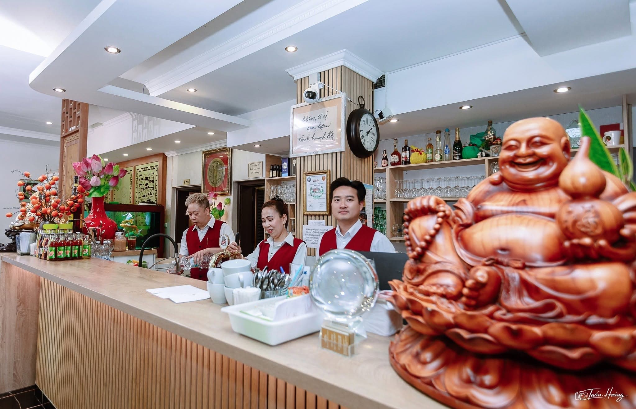 Reception bar with SEN staff and Vietnamese decorative details